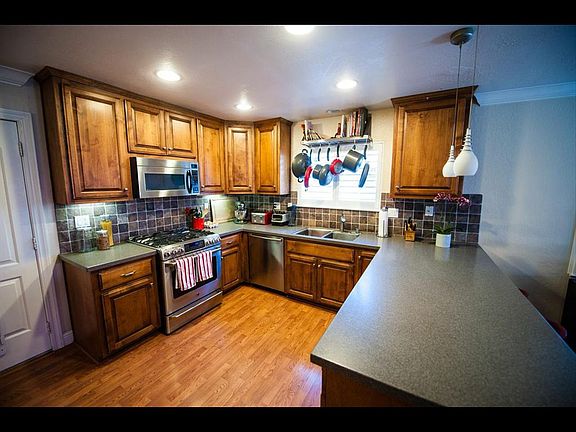 Custom cabinets, tile backsplash and Corian countertops.
