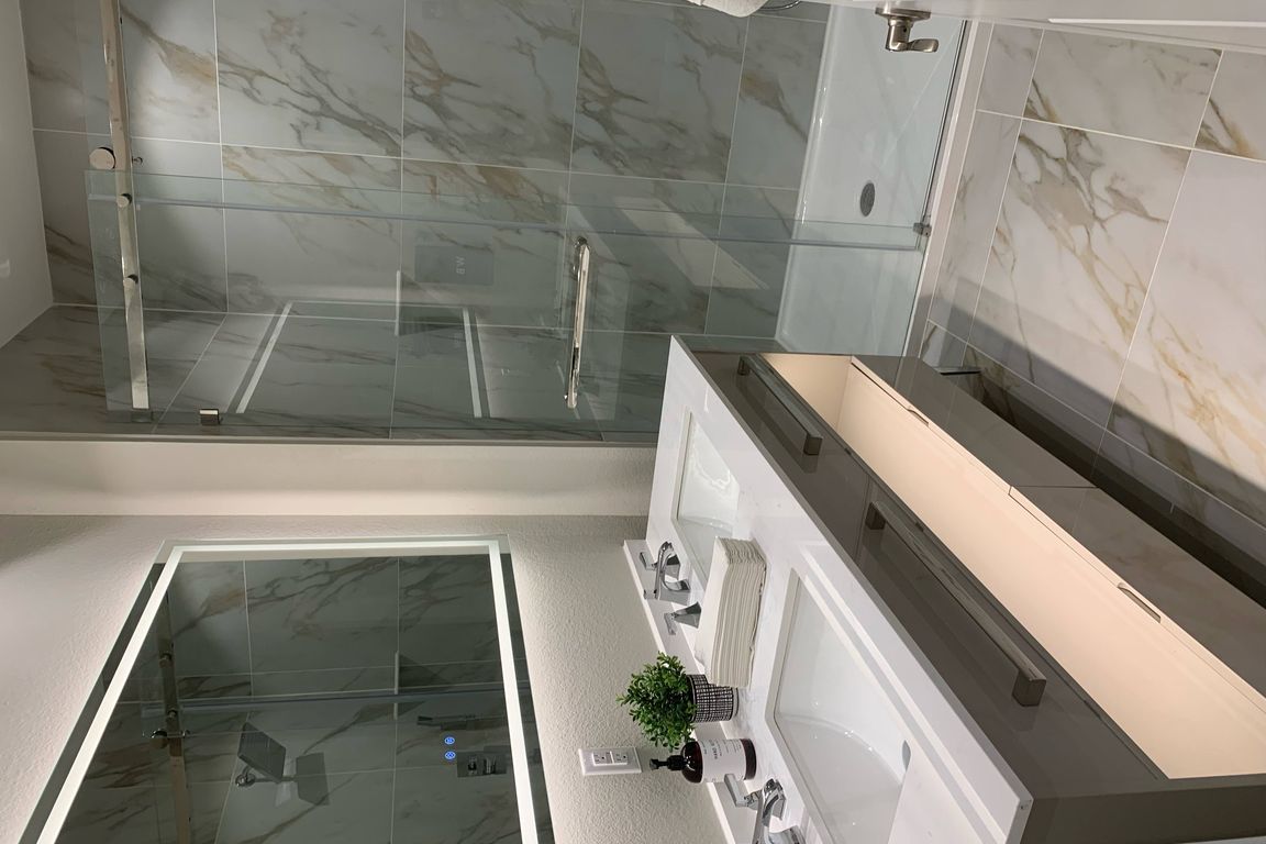 Dual Vanity Bathroom with Lighted Mirror