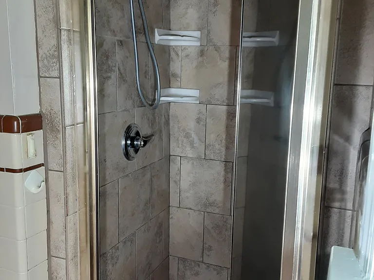 Full tiled shower in primary bathroom off of primary bedroom.
