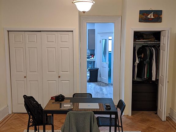 living room/dining room facing the kitchen - wall of closets