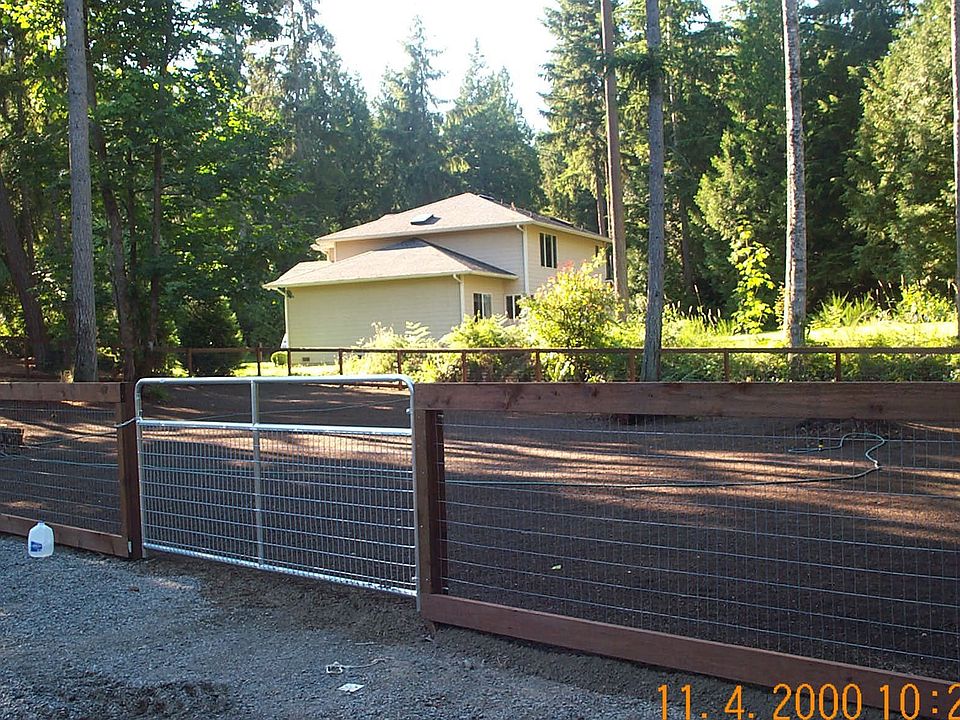 Fensed back yard n view of our nieghbors house