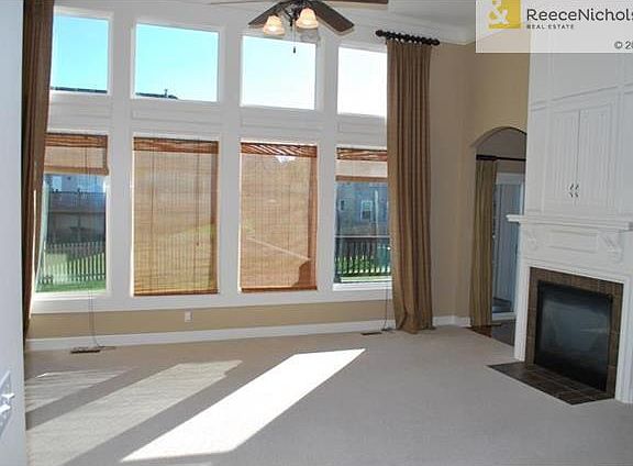 Awesome Xlarge Great Room with very high ceilings and expensive Transom Windows across the entire back wall.  See Thru Fireplace leads to Hearth Rooom