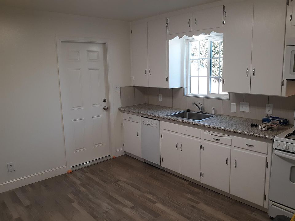 Remodeled kitchen with door to garage