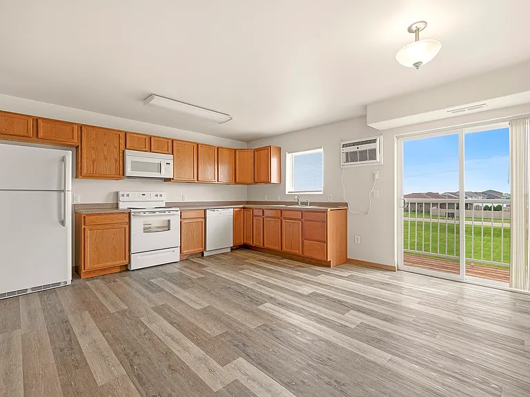 Elevate your culinary adventures in this stunning kitchen at Paramount at the Bluffs Apartments. With modern appliances and a spacious layout, it's the perfect setting for both cooking and entertaining. Schedule your tour today!