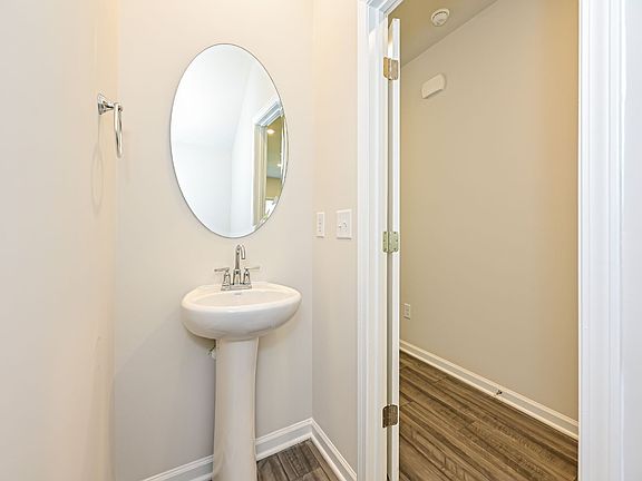 The convenient powder room is located off the great room.