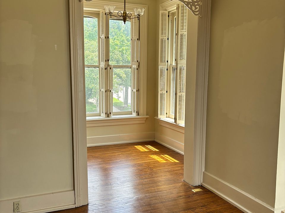 Sunroom with Victorian fretwork.