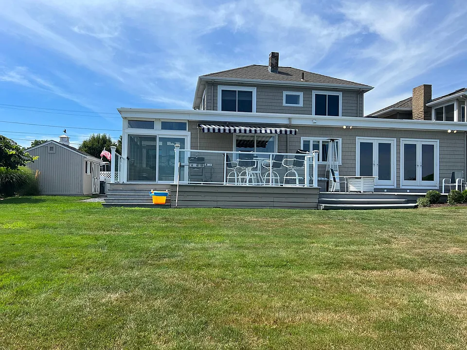 Even more views available from the stunning water-side deck. Enjoy dinner outside your pass-through window to the gourmet kitchen, while grilling on the deck. Sit by the propane fire pit and enjoy your favorite beverage while watching the ocean.