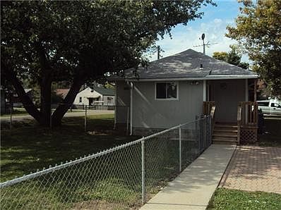 Side walk from garage and driveway to the rear entry of the home. Paver brick area perfect for grilling.