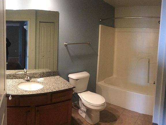 guest bath with granite top and tall toilet seat