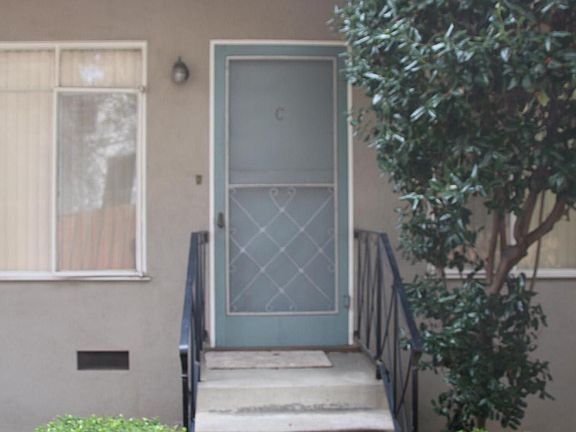 Ground level unit with a few steps up to it.