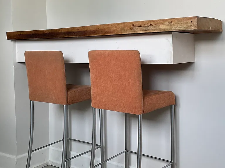 Built-in breakfast bar with space for stools. Home is rented unfurnished; breakfast bar stools may remain upon request.
