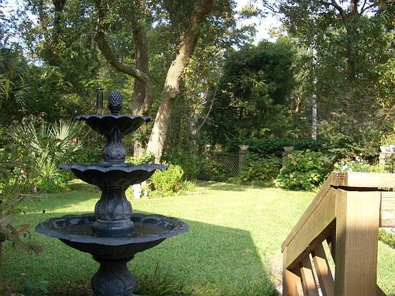 View of lush landscaping in back yard