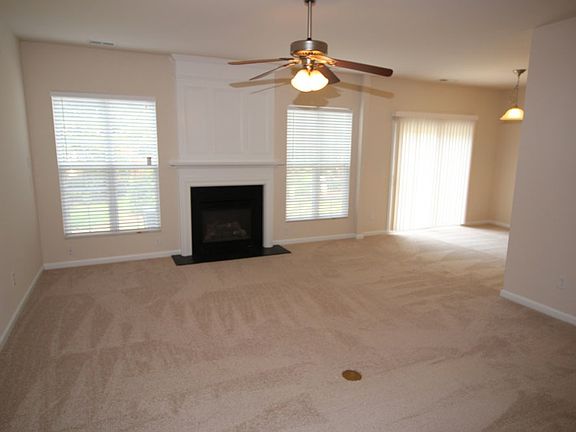 Spacious family room with NEW carpet, gas fireplace, ceiling