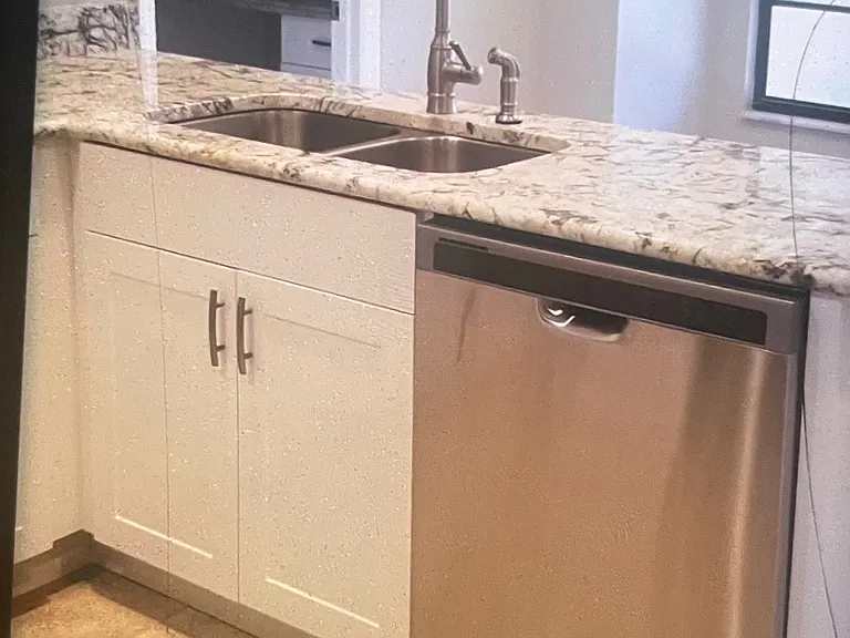 Renovated eat-in kitchen in 2018: opens to family room & handy to the laundry room .