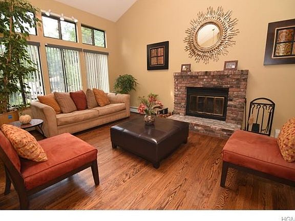 Sun filled living room with cathedral ceilings.