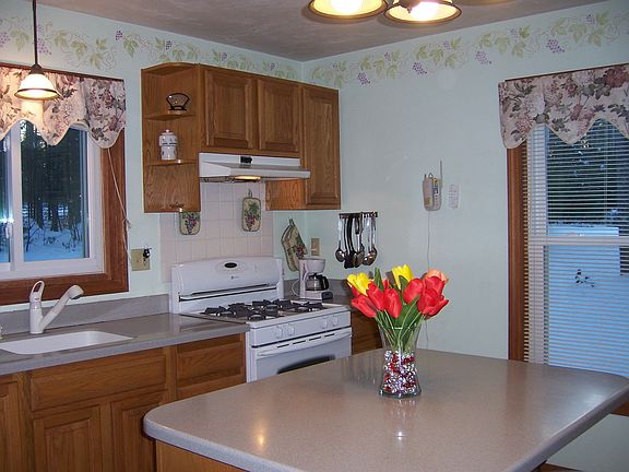 Kitchen-solid counters, oak cabs, island
