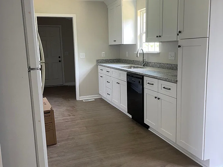 kitchen with plenty of storage and dishwasher