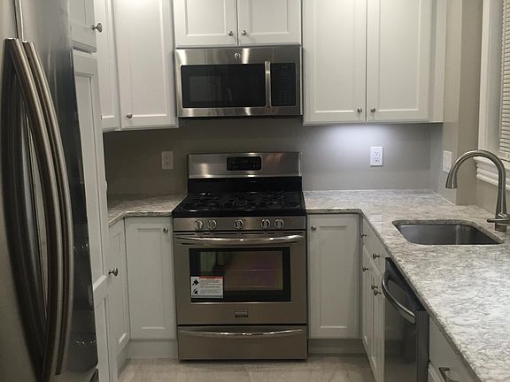 Kitchen was fully renovated in 2016- quartz countertops and stainless steel appliances (dishwasher, stove/oven, microwave, refrigerator)