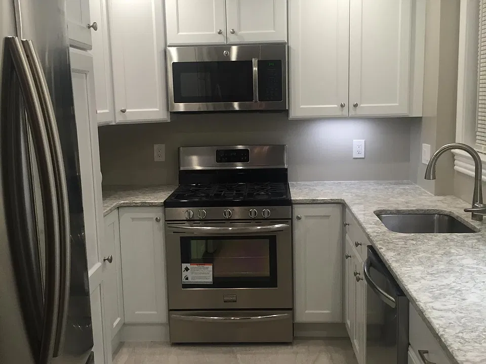 Kitchen was fully renovated in 2016- quartz countertops and stainless steel appliances (dishwasher, stove/oven, microwave, refrigerator)