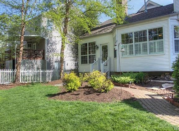 rear view of hard and great room bay window