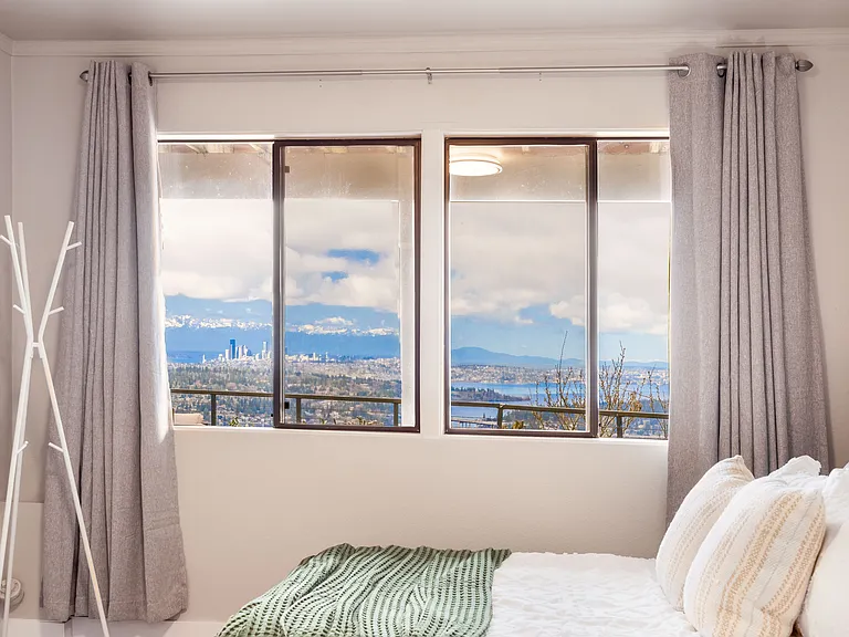 Wake up to stunning views from this master bedroom.The large window create a bright and inviting atmosphere.