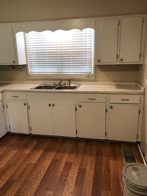 Kitchen:  New floor, fresh cabinet paint job, new handles.