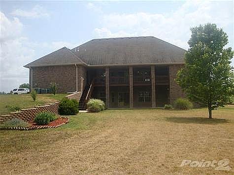 The back of the home is almost as pretty as the front!!! Huge covered deck and new stairs that land in the park like yard....3 ACRES!!! trees, landscape....all on a culdesac road!!!