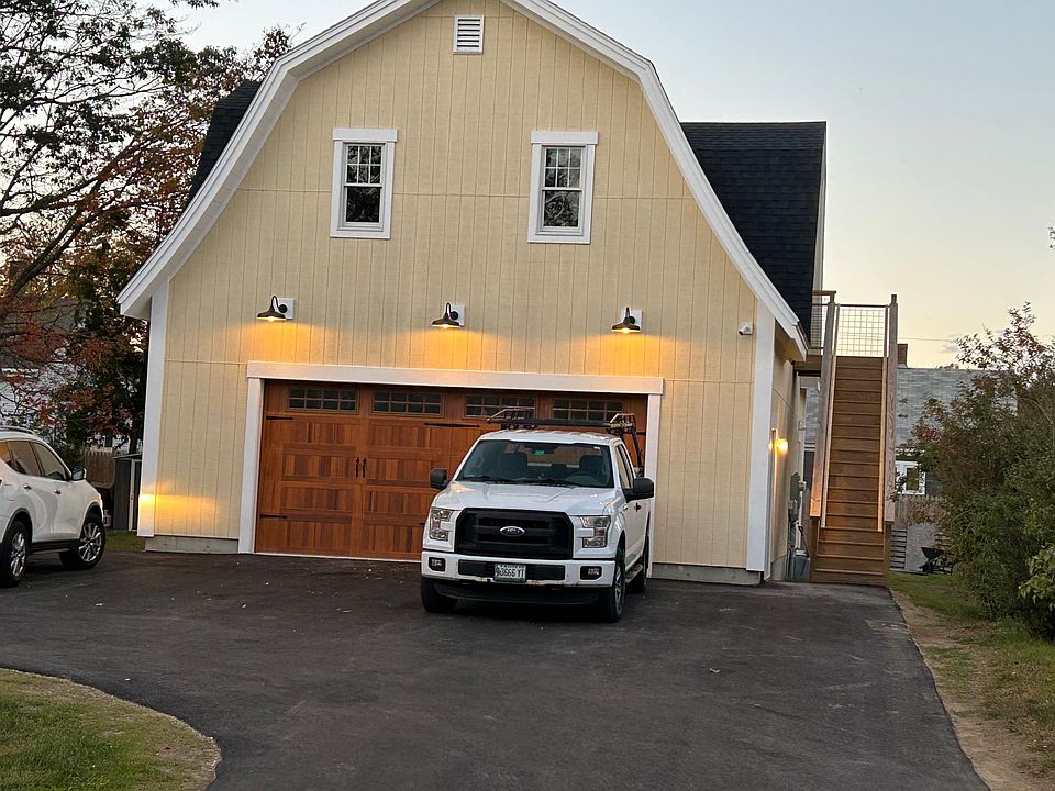 Entry to apartment. Stairs to second floor entrance. Small side garden below stairs. One parking space.