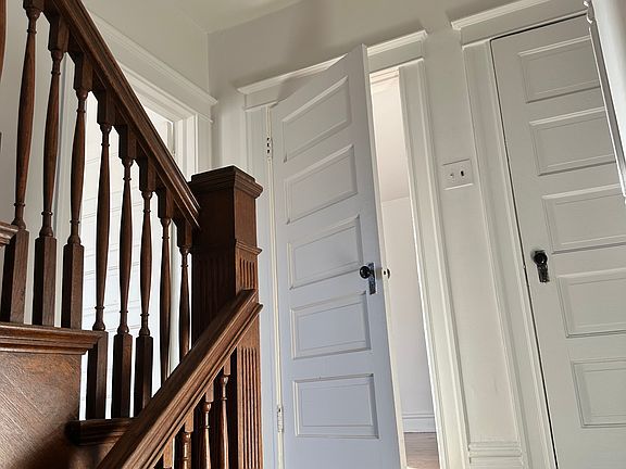 Stairs entering and First Bedroom Door