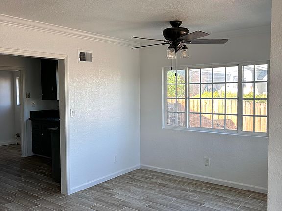 Entry to Living room 
with Kitchen and mud/laundry area behind kitchen to back yard