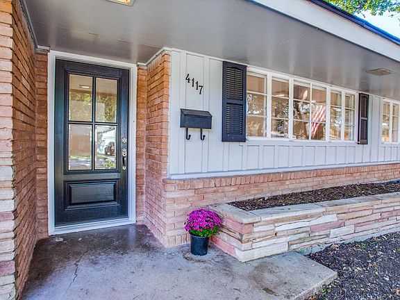 New wood front door that leads into an inviting entry.