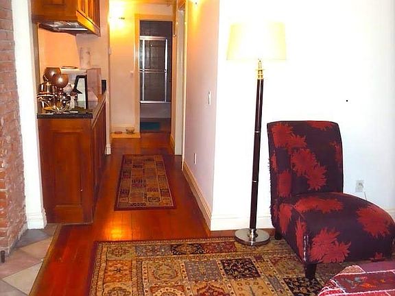 Another old tenant''s living room setting- hall wall to back room