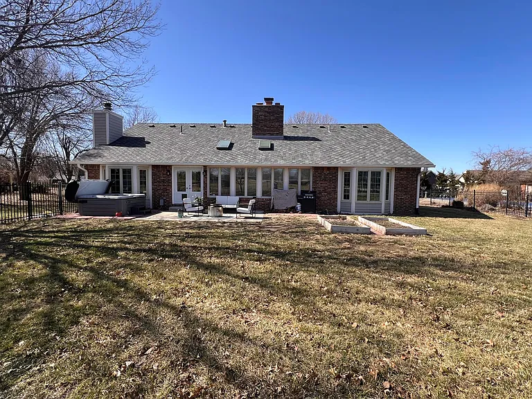 Large back yard with garden plots