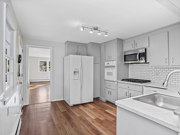 Modern gray and white theme with white tile back splash