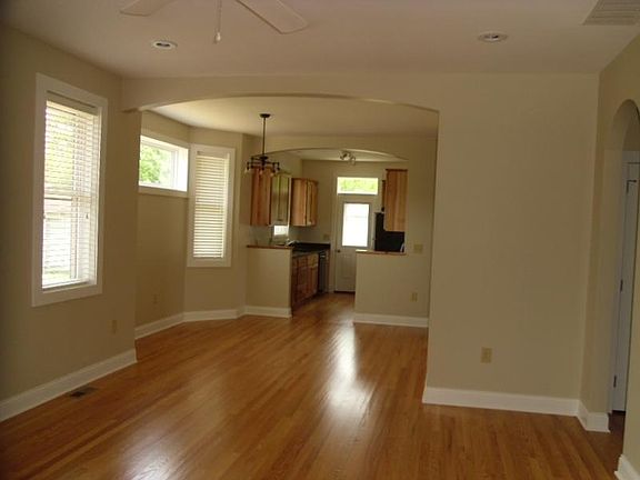 Open concept from living room looking towards dining room an