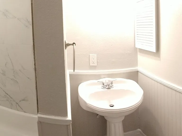 upstairs bathroom, panoramic view, new tub, new floor and wall tiles, new medicine cabinet