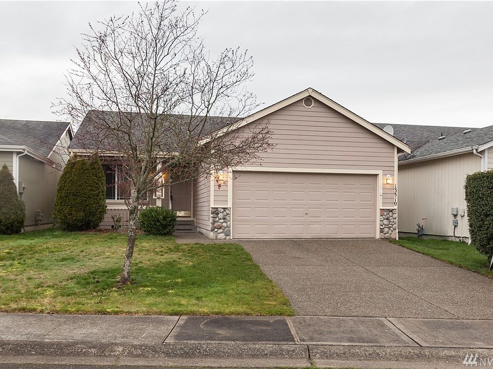 Very well-kept rambler in English Ridge neighborhood, a Puyallup gated community.  The front of the home features cement planking and stone decorative fascia; the cement driveway, walkway and porch are aggregate.