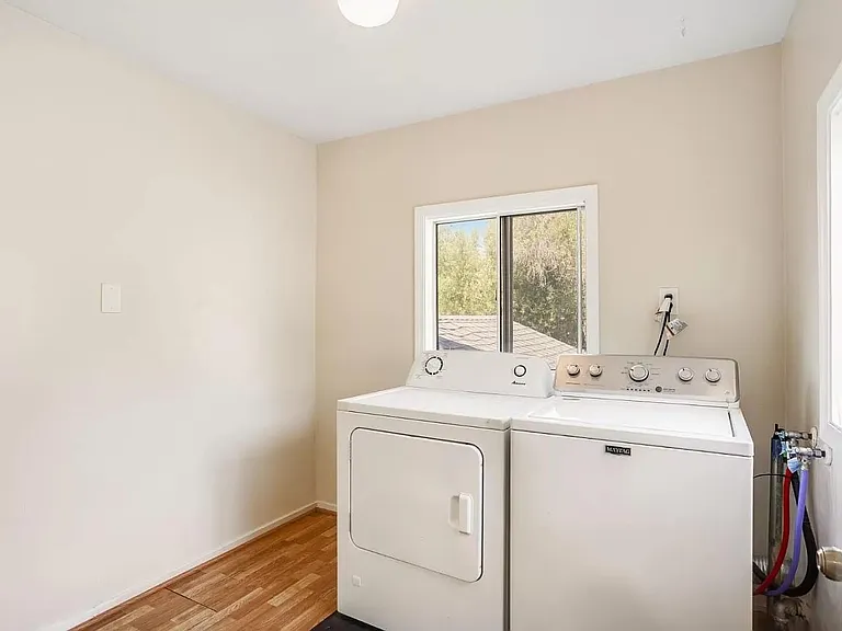 Separate laundry room with washer/dryer included