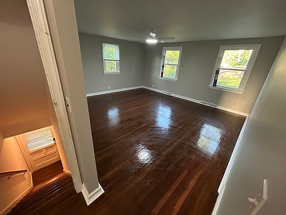 Living room- Overlooks Park - Grand Space with LED Custom Ceiling Fan. Centerpiece of Family Living