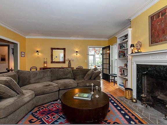 Scones add extra light to the room which leads to a seasonal porch.