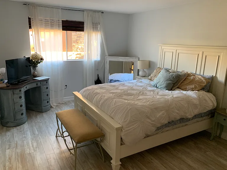 Large bedroom. Queen size bed in photo. Does not come furnished.