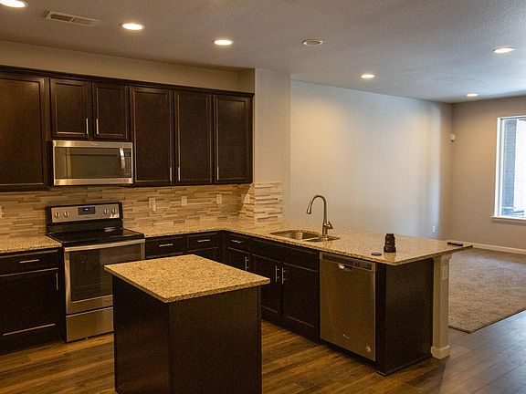 Kitchen comes with Electric stove, full sized refrigerator and freezer, dishwasher, sink with filtered water, and microwave.