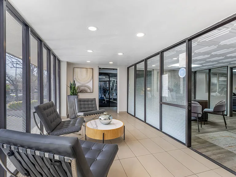 Step into comfort and convenience at Independence Plaza, where even the waiting room outside our leasing office feels like home sweet home.