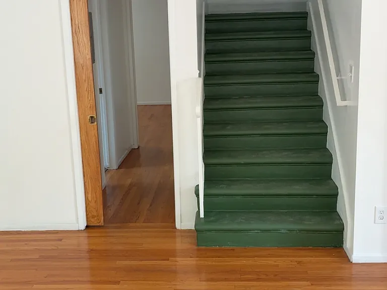 Downstairs hallway to Bathroom and Office