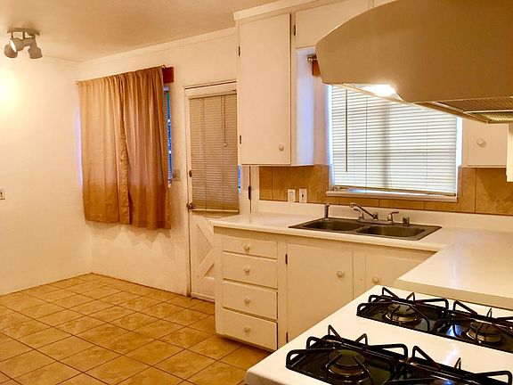 Kitchen dining area with tile floors.