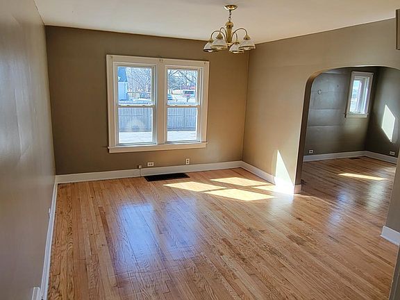 Dining room or family room with living room in backround. Dining room is 16ft by 12ft. Living room is 19ft by 12ft.