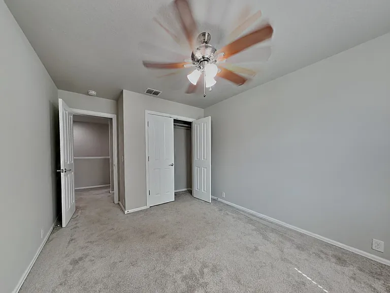Spacious bedroom with neutral