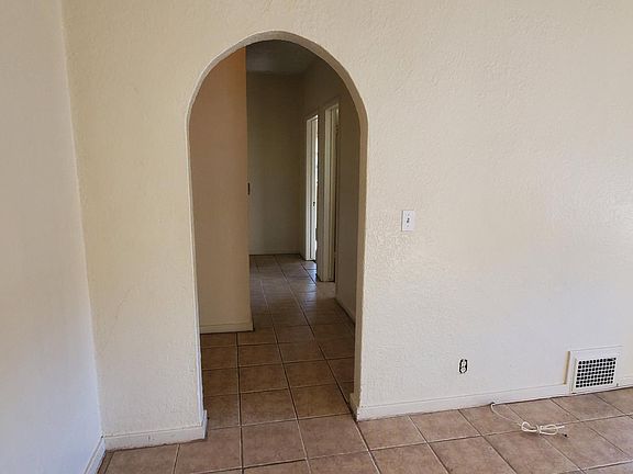 Hallway view from living room. Door on right is storage closet