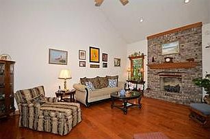 Great Room. Huge great room, hardwood flooring, gas log fireplace.  Lots of windows.  Wet bar and desk nook steps away.