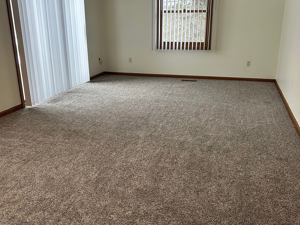 Family room area with slider that goes out to side yard. This is an end unit, so you only have neighbors on one side of you.